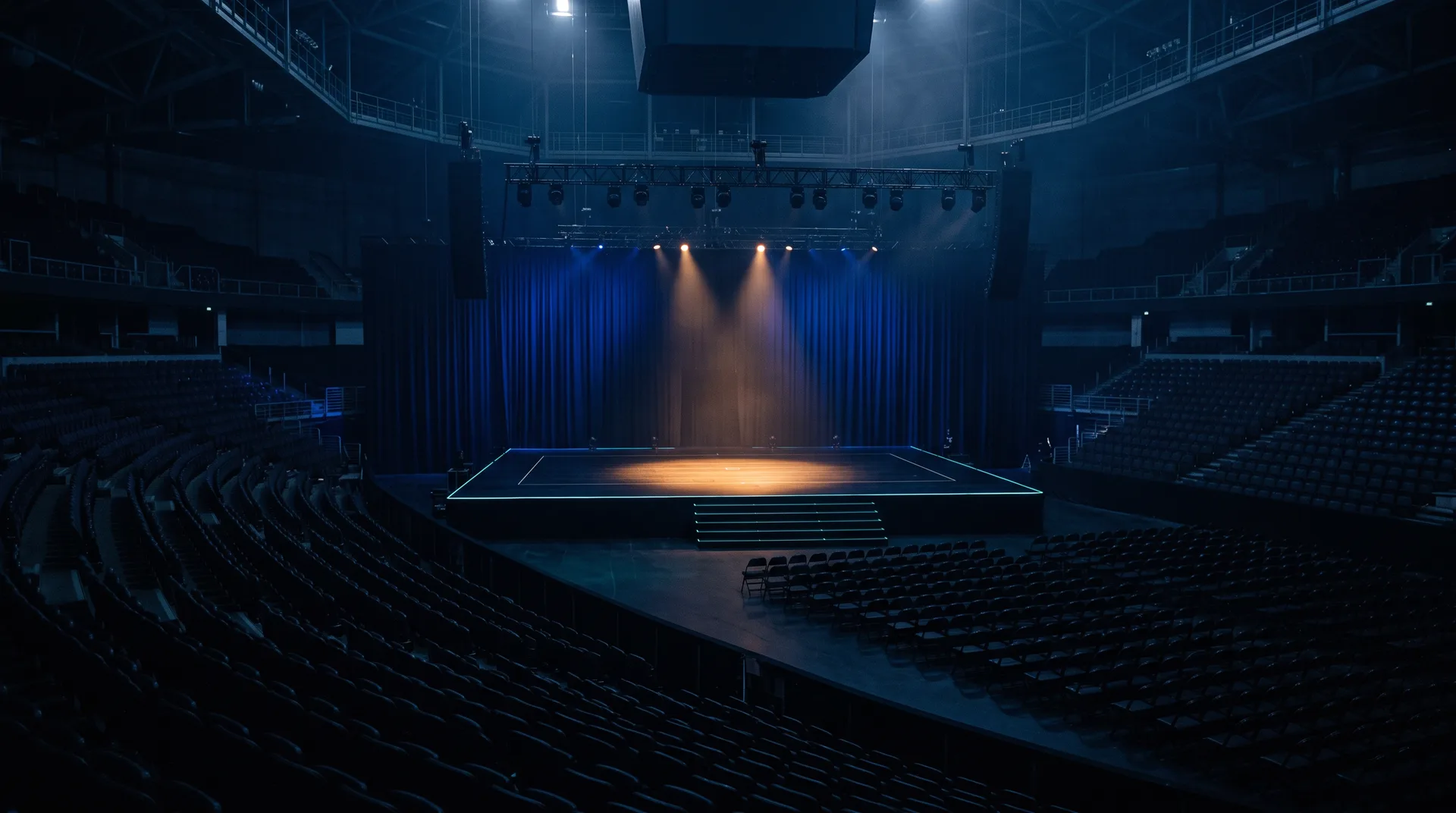 An empty competition stage under a single spotlight